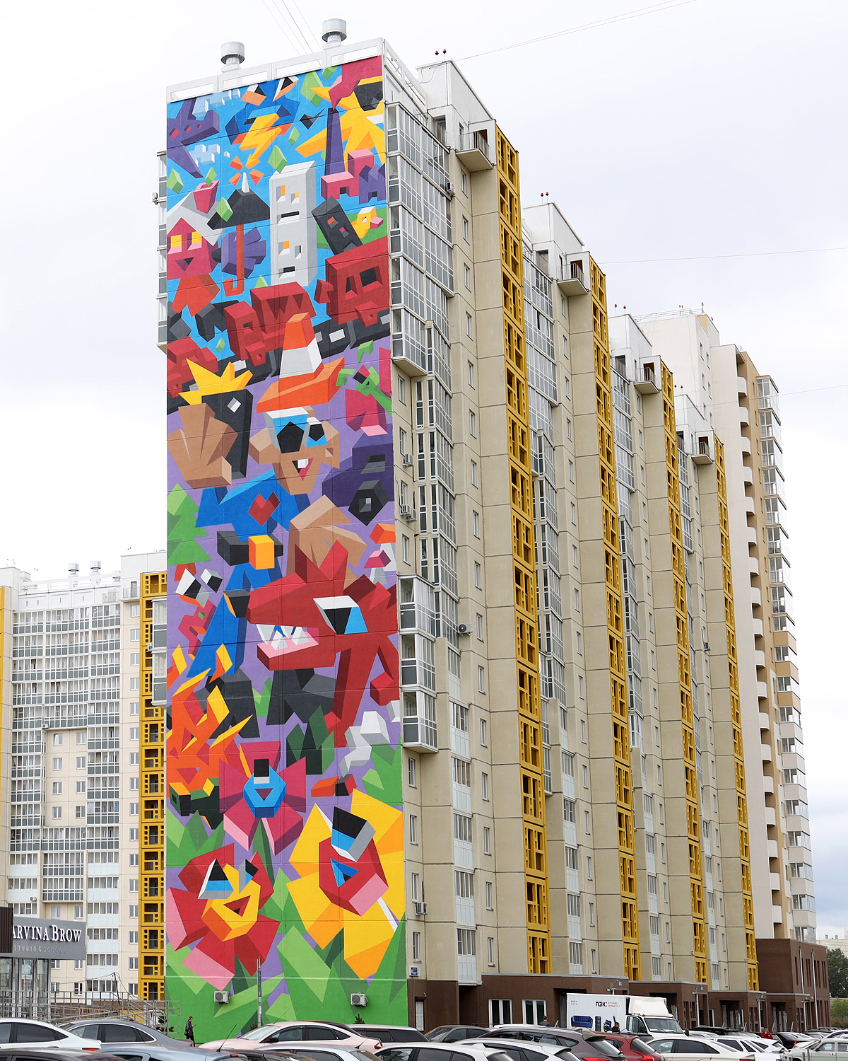 A Colorful Geometric Mural of a Cityscape Visualizes Humans’ Impact on Nature | 国外美陈 美陈网站 美陈前沿 